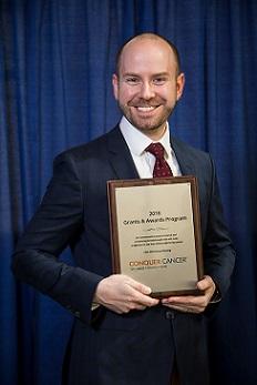 Dr. Brian Miller receiving an endowed Dr. Jane C. Wright YIA at Annual Meeting