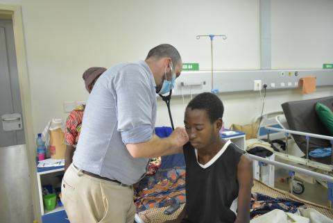 Dr. Painschab providing care for a patient in the clinic.