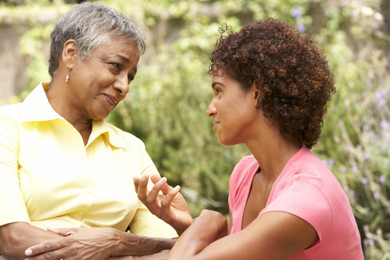 A mother and her daughter shown connecting through heartfelt conversation.