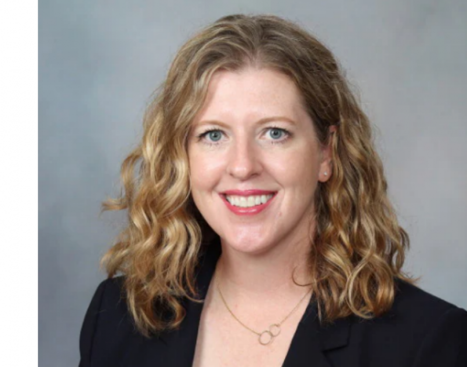 Headshot of Dr. Wendy Allen-Rhoades. She is smiling, facing forward. She is wearing a black blazer over a white shirt, with a smal golden necklace. Her hair is light brown and shoulder-length.